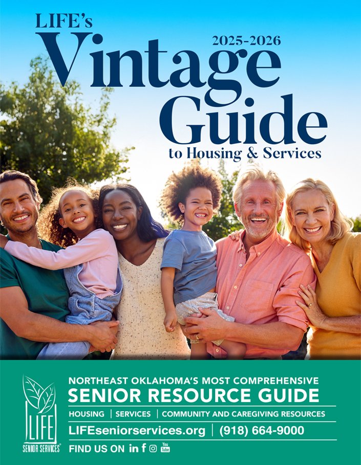 Group photo of smiling seniors and children outdoors on a sunny day, brochure for LIFE senior services' 2025-2026 vintage guide, including contact information and resources for housing, services, and caregiving.