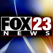 FOX 23 News logo with a blue and yellow background